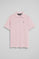 Pink short-sleeve polo shirt with three buttons and Rigby Go embroidered logo