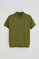 Green polo shirt with Rigby Go embroidery