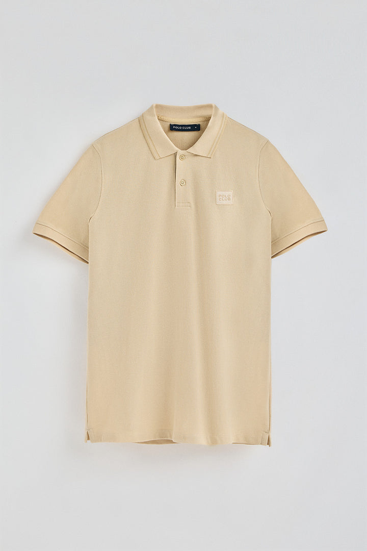 Ivory short-sleeve polo shirt with two buttons and chest detail