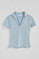 Light-blue buttonless polo shirt in linen and cotton with Rigby Go embroidered logo