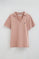 Pale-pink cotton-linen polo shirt with buttonless collar and Rigby Go embroidery